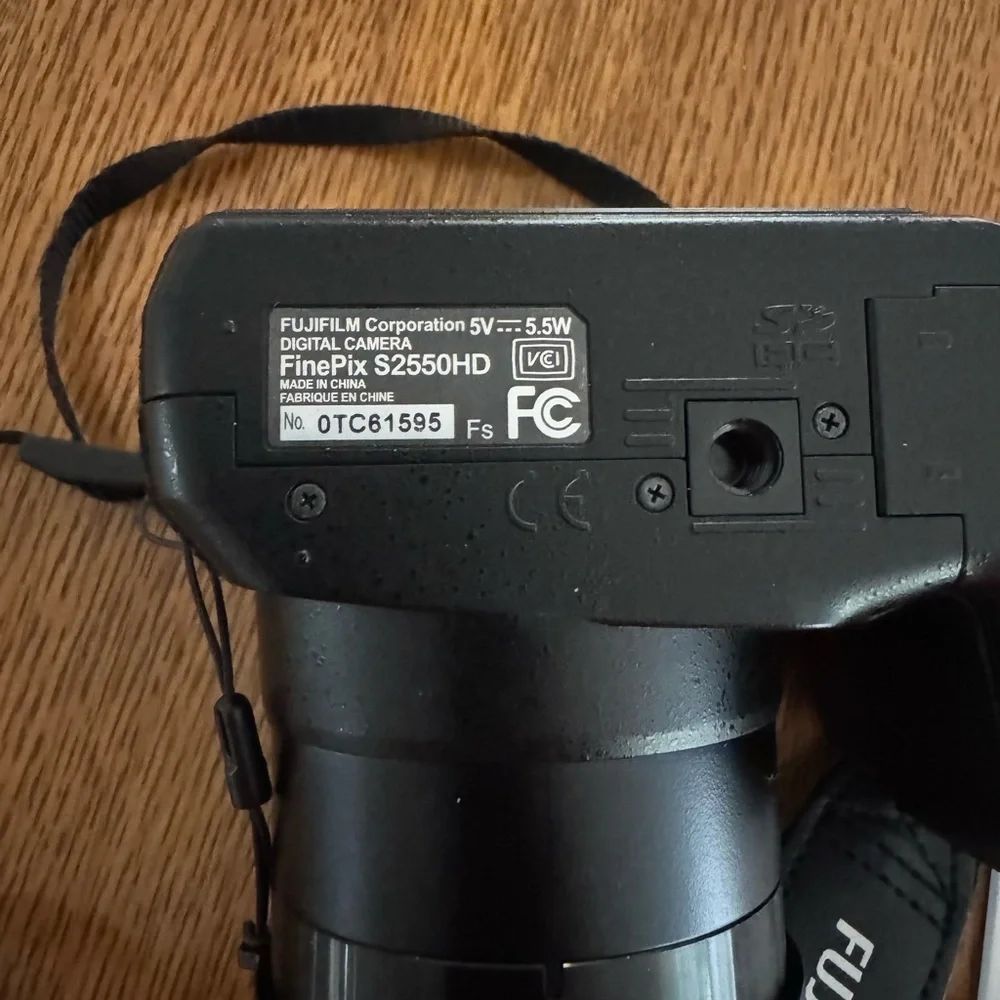 Fujifilm Black Digital Model S2550HD Camera with Zoom Lens and Ergonomic Grip.